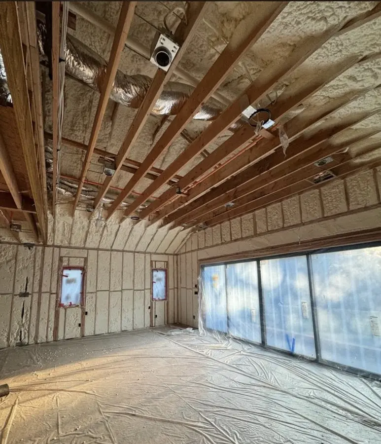 Interior walls and ceiling insulated with spray foam during new construction in Bedford
